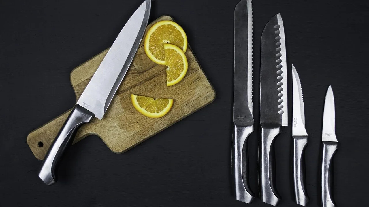 Kitchen knife set with multiple knives displayed on kitchen counter