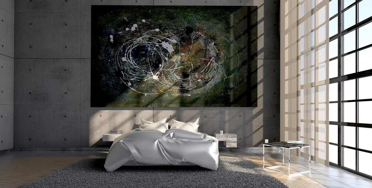 Large decorative wall mirror hanging in modern bedroom with natural light