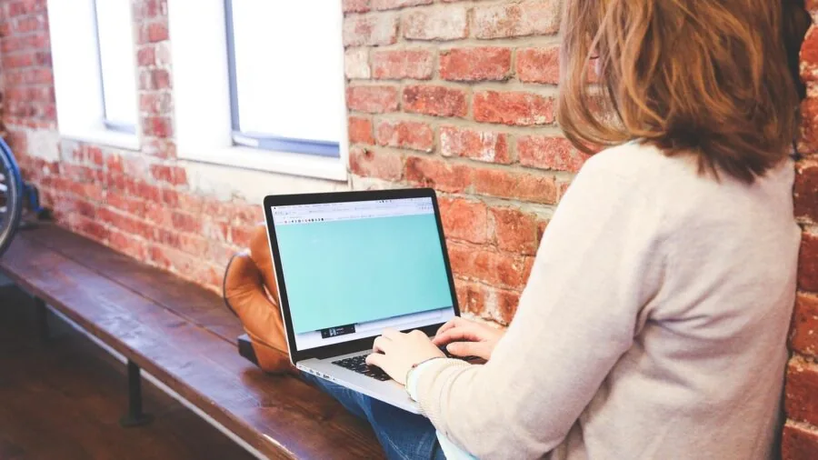 Lifestyle photo showing someone working at a desk with various keyboard layouts and sizes for comparison