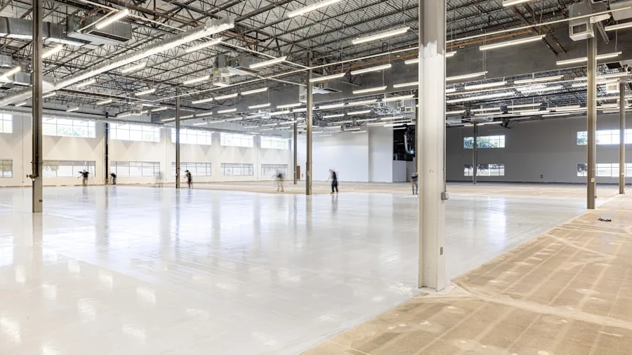 Maintenance team cleaning large commercial building interior with multiple work areas and floor sections