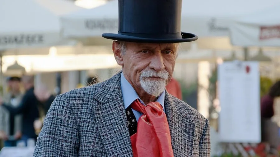 Man browsing formal attire options at different price points, considering quality and value