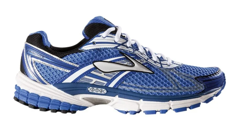 Man examining shoe fit and comfort while trying on walking shoes indoors