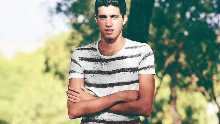 Man in breathable fabric shirt enjoying outdoor comfort during warm weather