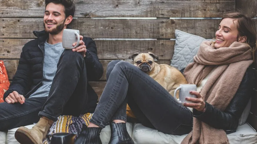 Man in comfortable fleece sweatpants sitting on couch during casual day at home