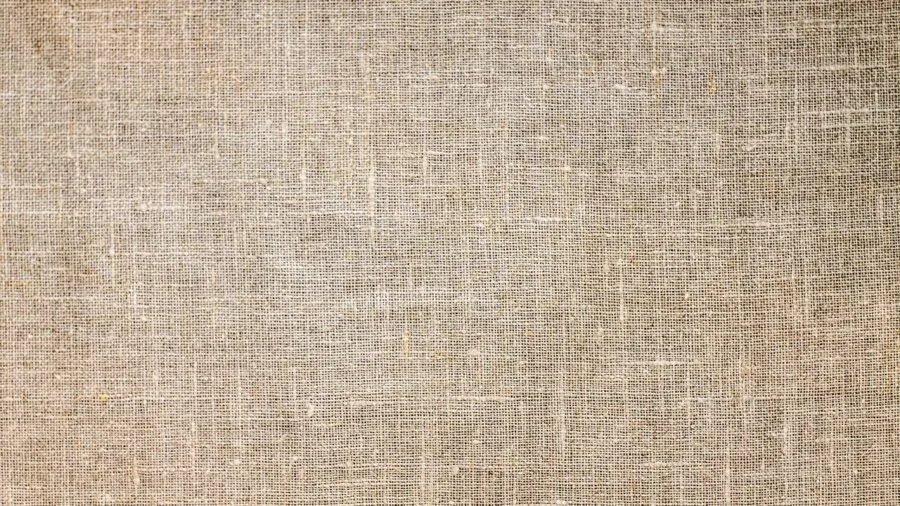 Man inspecting and feeling different fabric textures and materials with hands