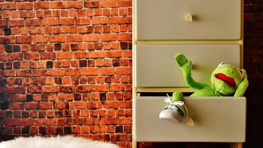 Man organizing and folding socks while building his dress wardrobe collection