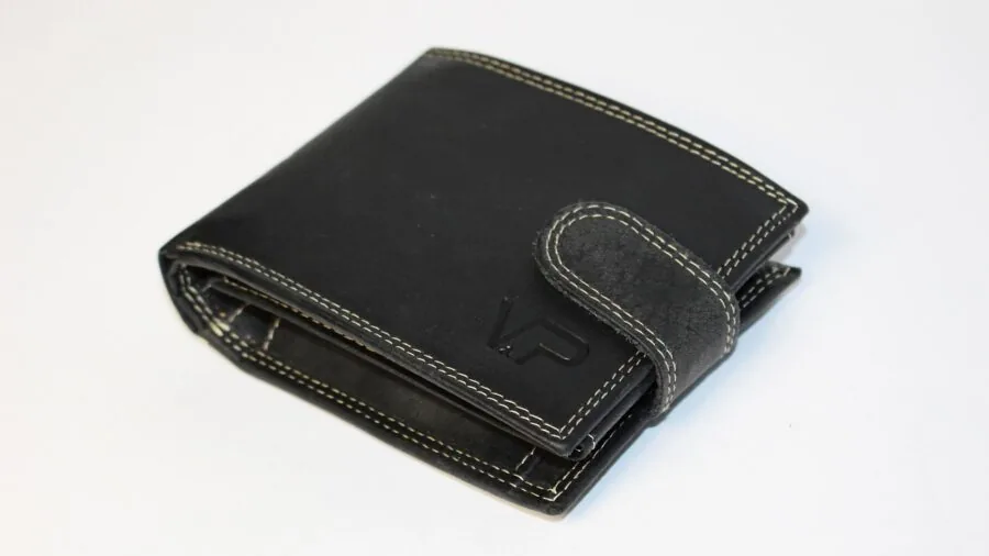 Man thoughtfully examining wallet and considering budget choices for personal finance