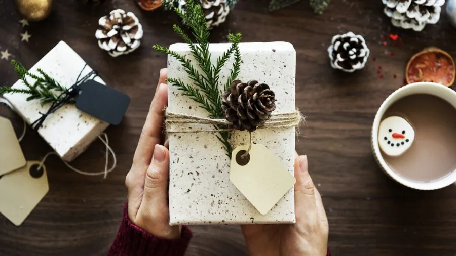 Man unwrapping a gift box, lifestyle present opening moment