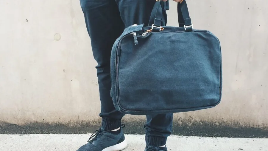 Man wearing casual outfit selecting accessories for different occasions and style contexts