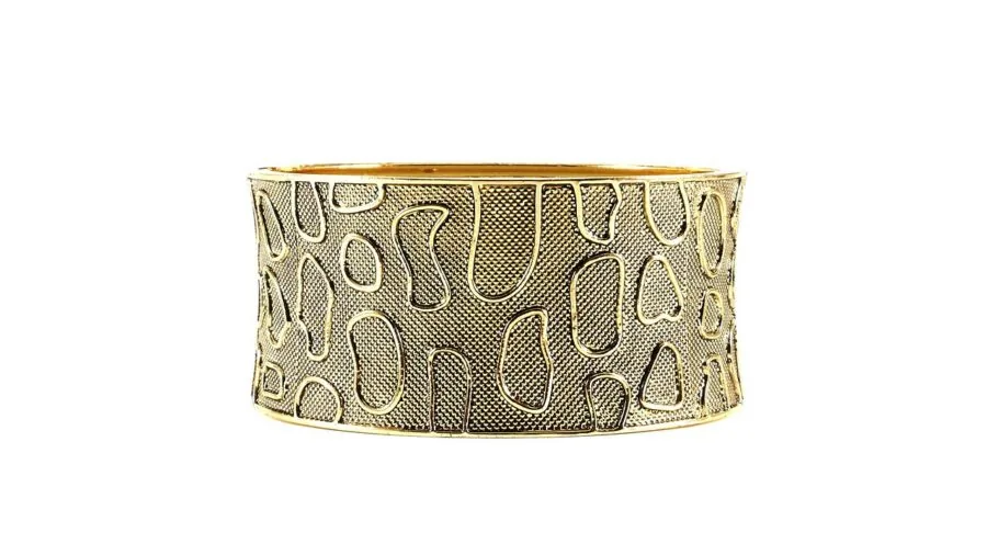 Man's wrist displaying durable metal bracelet in natural light, showing material quality and craftsmanship details