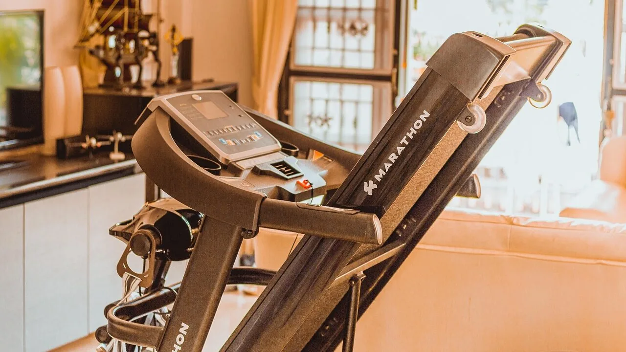 Manual treadmill displayed in home gym setting with clear product view
