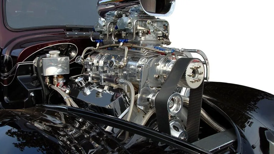 Mechanic examining car engine with diagnostic tools to identify mechanical problems