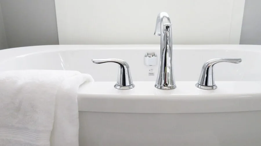 Minimalist bathroom with clean surfaces and modern fixtures emphasizing durability and easy maintenance