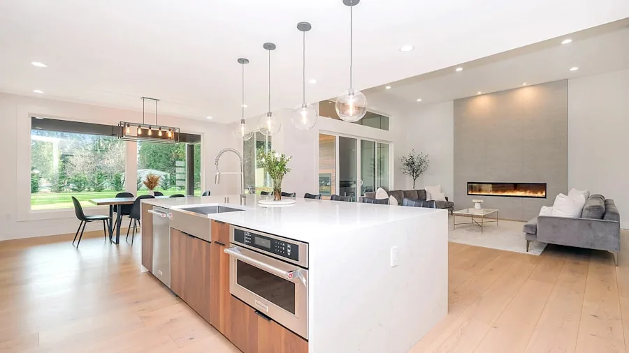 Modern kitchen interior with open refrigerator showing organized food storage in contemporary home