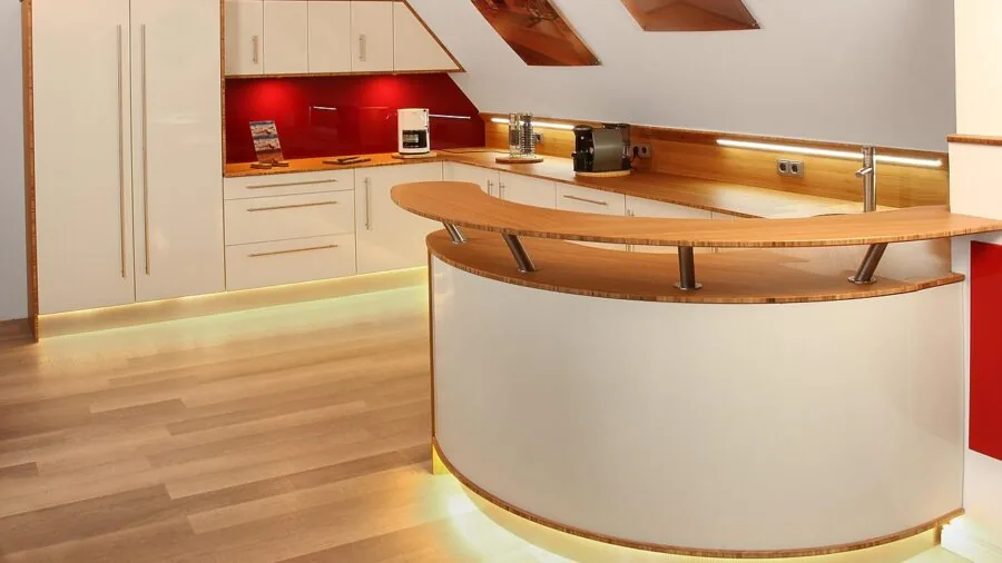 Modern kitchen with open countertop space and cabinetry, showing typical dishwasher installation area
