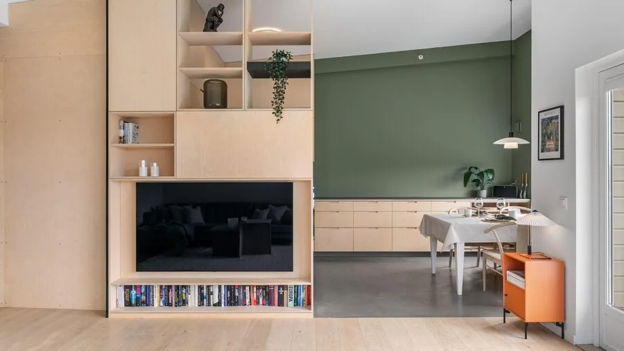 Modern kitchen with open shelving displaying organized dishes and kitchen items in natural light