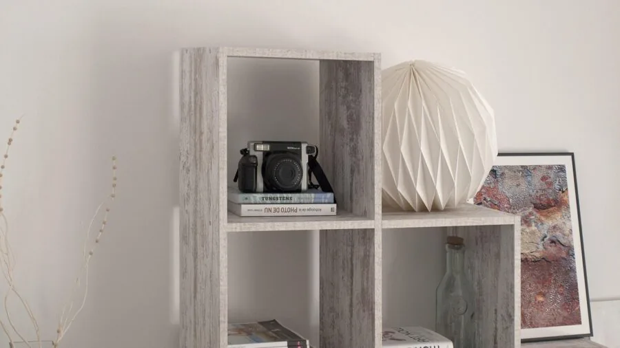 Modern living room with organized shelving and decorative items displayed on walls and furniture