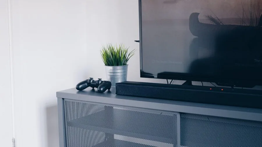 Modern living room with television mounted on media console furniture against wall
