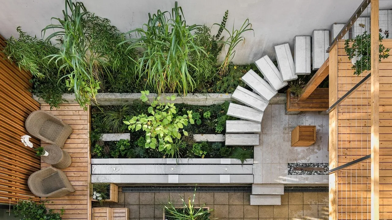 Modern outdoor sofa on a residential patio with natural landscaping in background