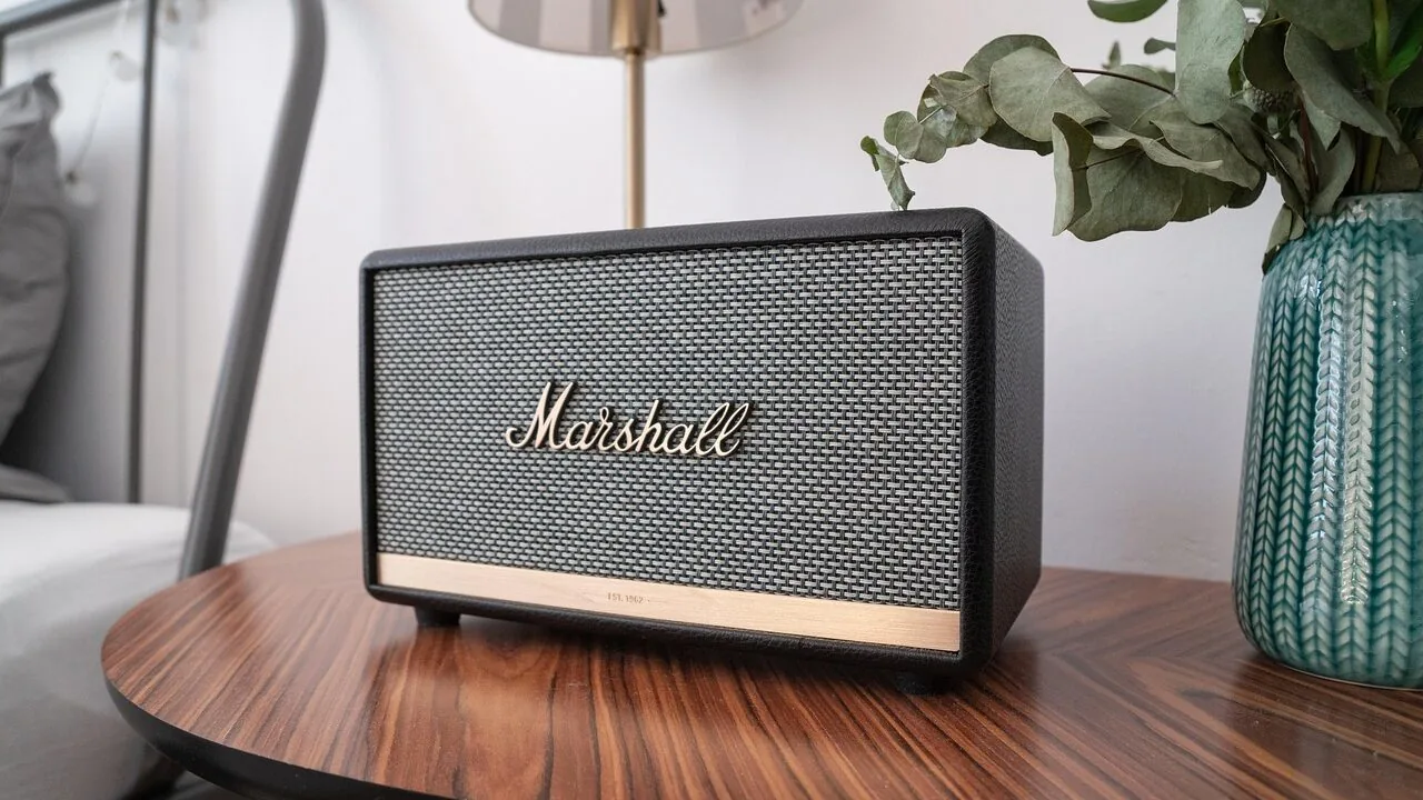 Multiple portable bluetooth speakers displayed together on a surface