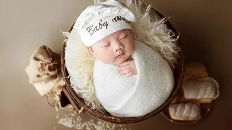 Newborn infant exploring high contrast black and white patterns for visual development and sensory stimulation