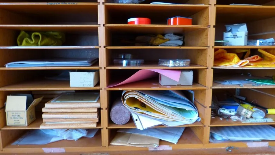 Organized baby care items neatly arranged in a wooden drawer with compartments for easy access