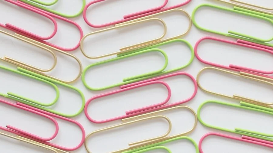 Organized cleaning supplies and mop accessories neatly arranged together on a light background