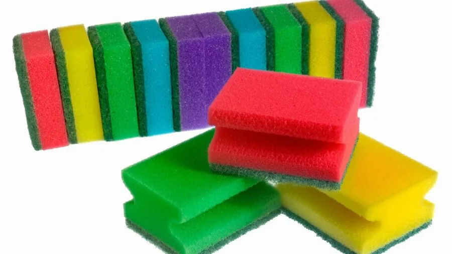 Organized collection of various cleaning tools and attachments neatly arranged on wooden surface indoors