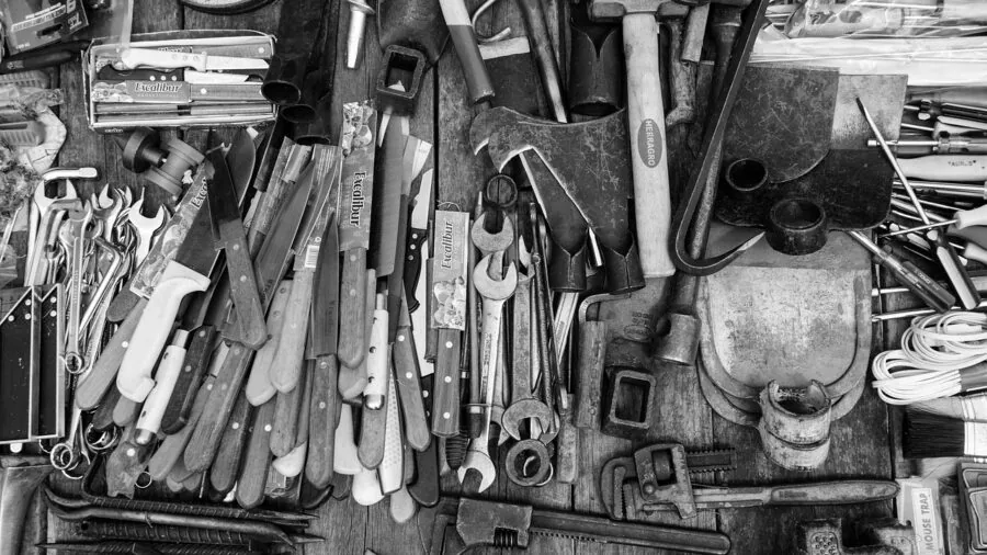 Organized collection of various screws and fasteners sorted by size in compartments