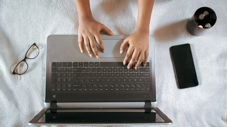 Organized workspace with multiple devices and cables neatly arranged on a desk