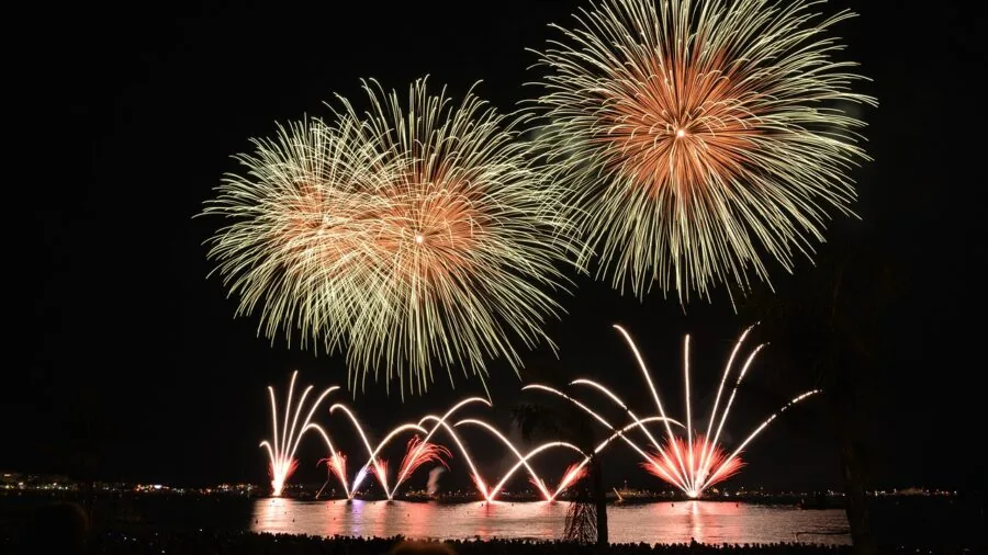 Outdoor evening party with colorful lights and decorations creating magical atmosphere