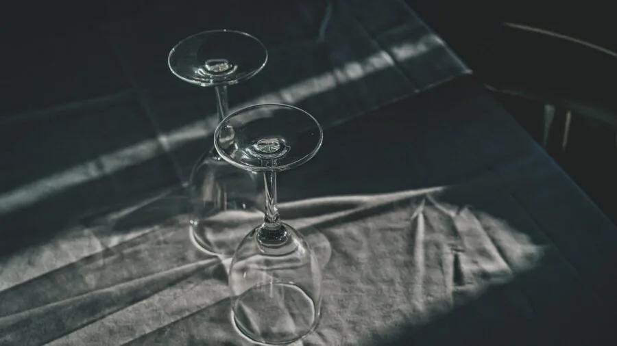 Overhead view of a dining table set with multiple place settings and dishes arranged for a meal