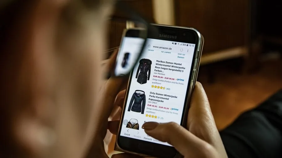 Parent and child browsing affordable summer clothing options in a store