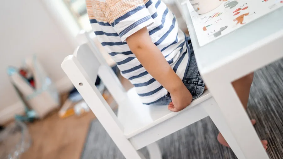 Parent cleaning and rinsing toddler cup at kitchen sink with warm water