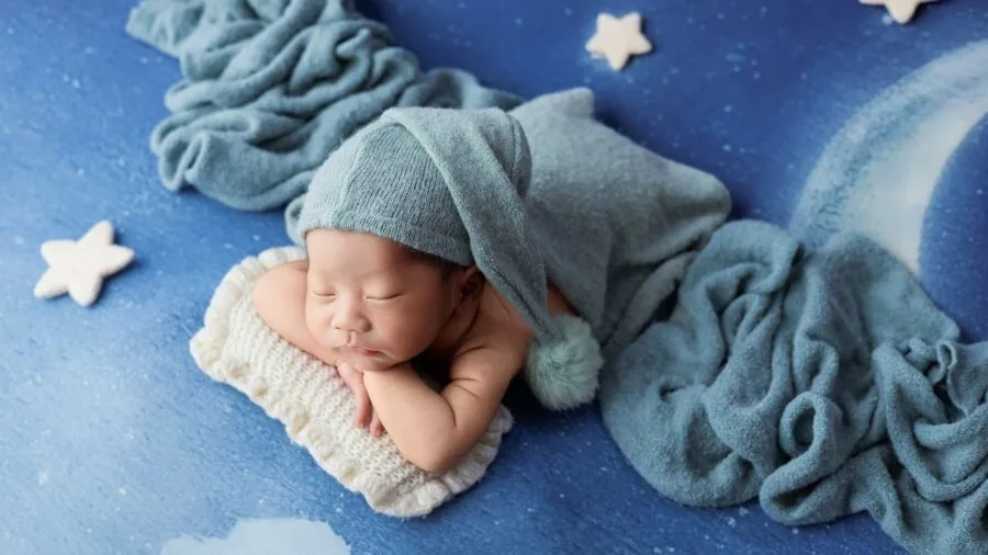 Parent gently soothing peaceful infant with soft rocking motion in natural home setting