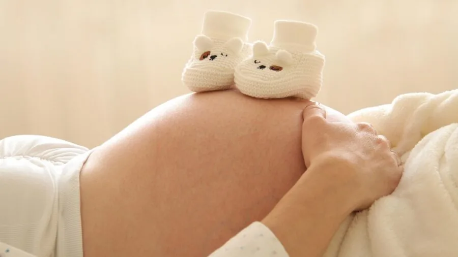 Parent nursing infant in comfortable home setting, demonstrating practical breastfeeding moments