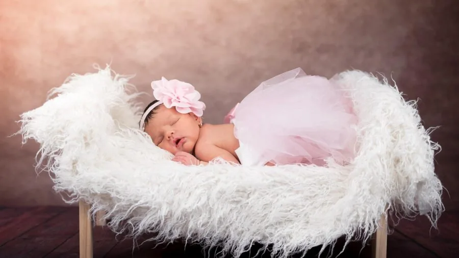 Peaceful infant sleeping soundly in a well-ventilated crib with soft bedding