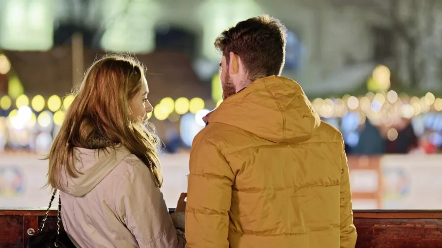 People of different genders exploring fragrance options in a modern setting