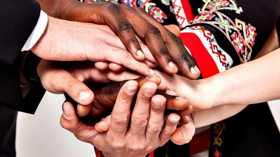 People of different heights performing dip exercises at an outdoor fitness station