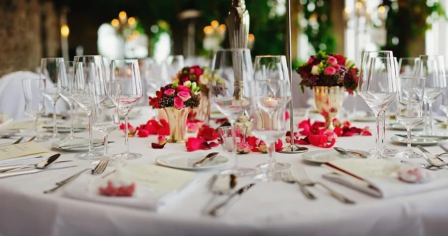 People quickly assembling decorations for a party celebration with guests arriving