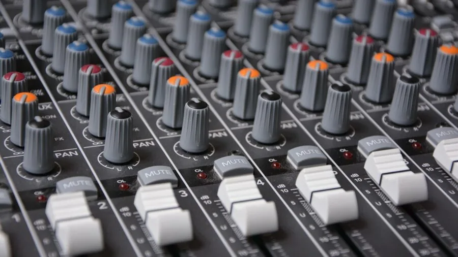 Person adjusting audio volume slider on device in home setting, demonstrating sound control and masking power