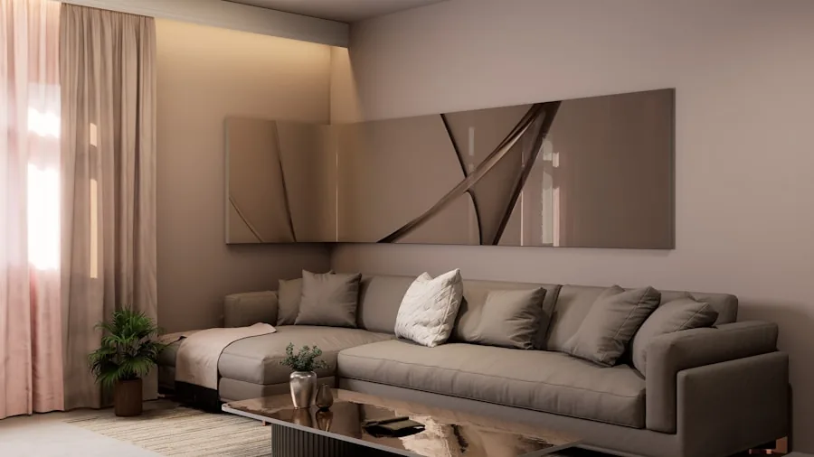 Person adjusting ceiling fan with remote control in bright contemporary living room