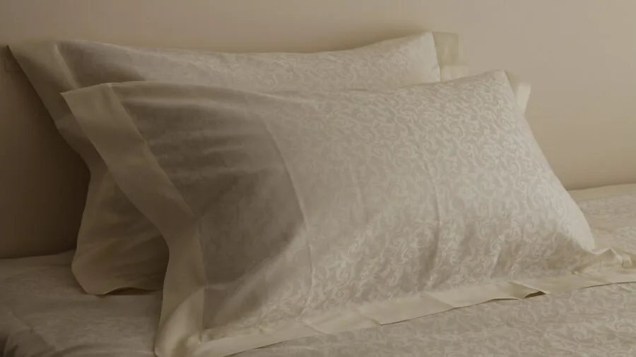 Person adjusting humidifier settings in bedroom during dry season to maintain optimal moisture levels