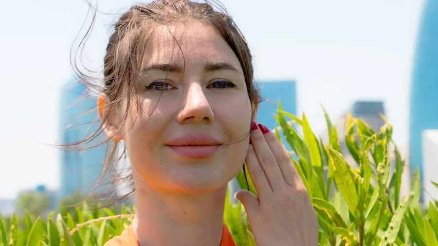 Person applying sunscreen to face while enjoying outdoor sunny activities
