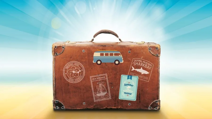 Person carefully examining luggage choices while planning a trip, evaluating quality and value