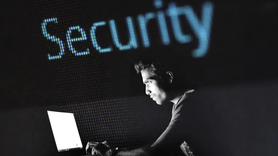 Person carefully handling and protecting laptop computer during travel and daily use