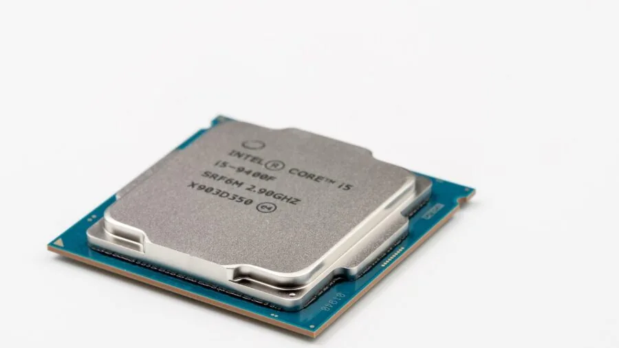 Person carefully installing CPU processor into computer motherboard socket during PC build