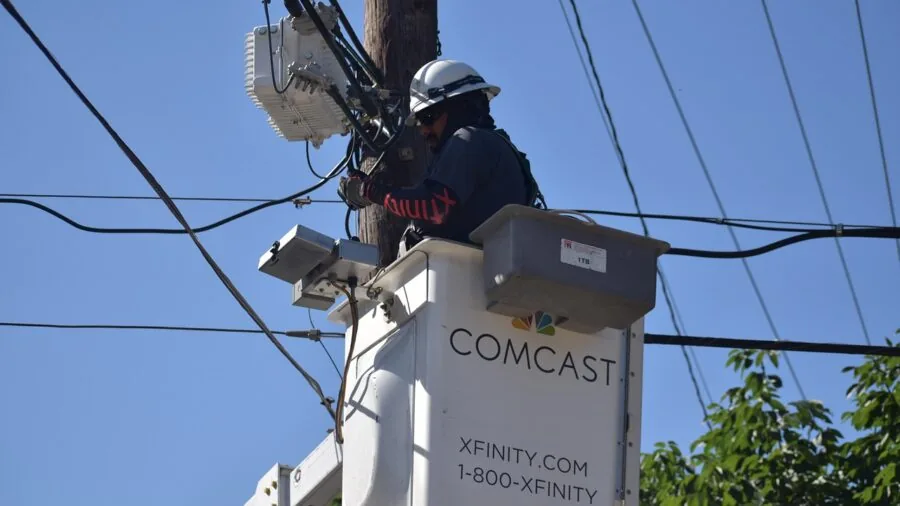 Person carefully installing electrical wires and connectors during home renovation project