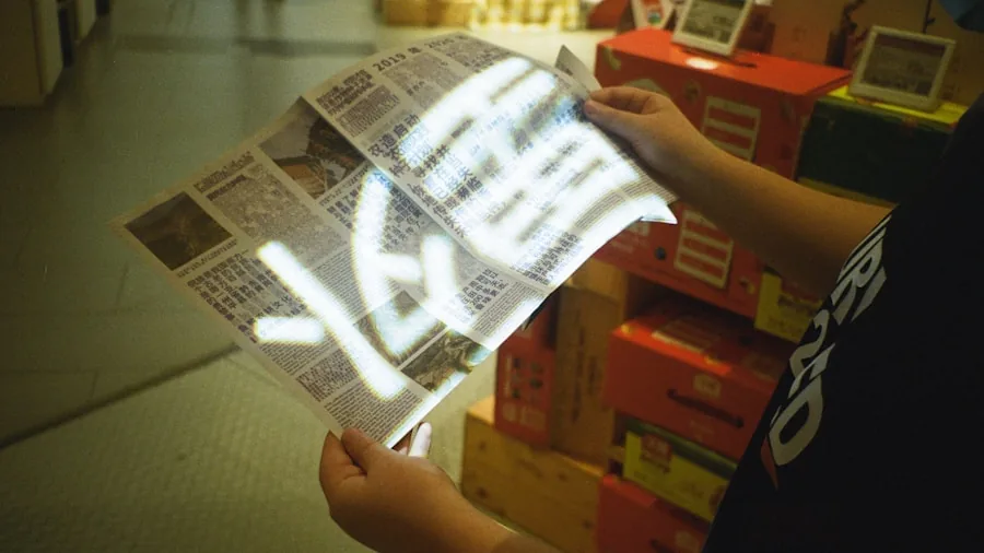 Person carefully reading product packaging and specifications while sitting at home
