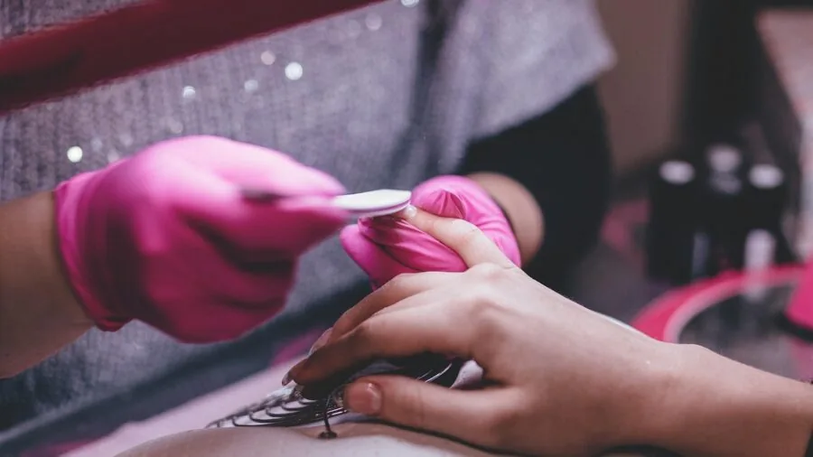 Person carefully trimming nails as part of personal hygiene and grooming routine